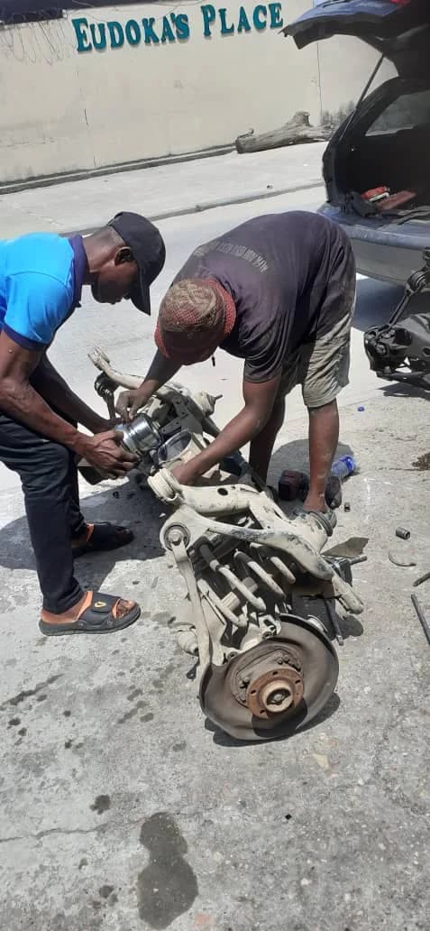 Two ONYEBEST technicians rebuilding a Volvo rear axle assembly at Ladipo Volvo Plaza, Mushin, Lagos